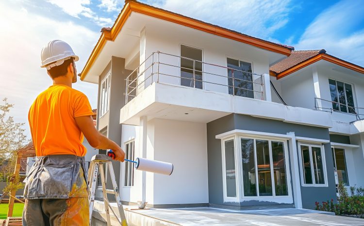 Painter of a newly built house, Painter holding a paint roller skillfully paints a house, A house under construction nearing completion has a painter applying a white primer. Painter of a newly built house, Painter holding a paint roller skillfully paints a house, A house under construction nearing completion has a painter applying a white primer.